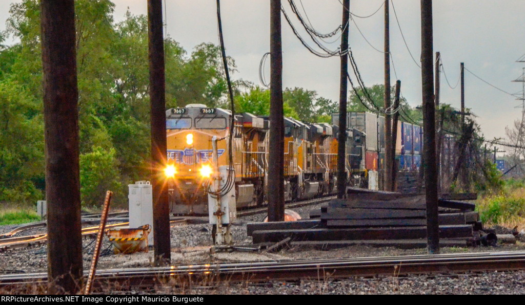 UP AC45CCTE locomotive leading a train in the Yard